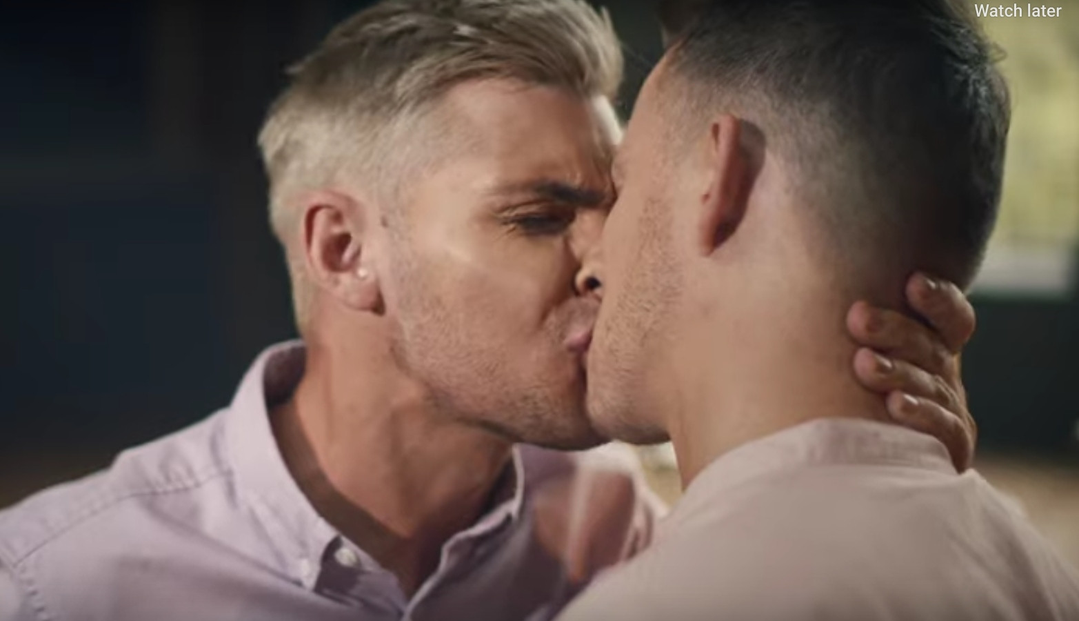 gay men kissing.