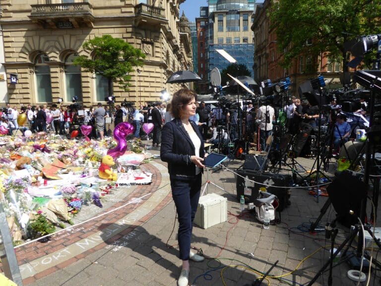 Global media cover the floral tribute to the arena bombings victims. Ardfern/Creative Commons